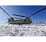 Image of iCanvas Snow Flies Up As A US Army CH-47 Chinook Helicopter Prepares by Stocktrek Images - Canvas Print